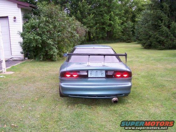 1994 Ford Probe rear view with large spoiler and aftermarket exhaust tip