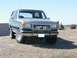 1989 Ford Bronco - This 1989 Ford Bronco is shown in a front 3/4 view, a prominent chrome grille guard and a silver exterior.