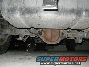 Underside view of a rear axle assembly and fuel tank