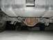 1989 Ford Bronco - Underside view shows the rear axle and fuel tank of a vehicle.
