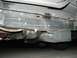 1989 Ford Bronco - Close-up view of the undercarriage of a vehicle, showing the frame and fuel tank.