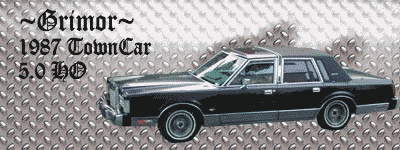 Black 1987 Lincoln Town Car, 3/4 front view, chrome trim, diamond plate background
