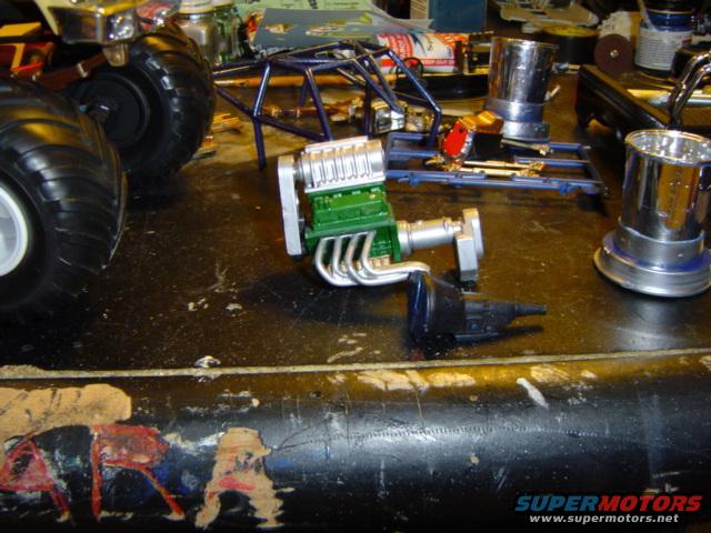 Model car engine and transmission parts on a workbench