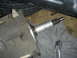 1986 Ford Mustang - A transmission part is shown with a ratchet nearby, resting on a gray cloth.