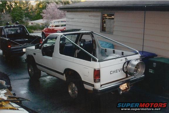 White Chevrolet S-10 Blazer with a spare tire mounted on the back, seen from the rear