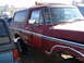 1979 Ford Bronco - A red 1978 Ford Bronco is parked next to a dark blue vehicle.