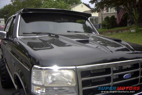 Black 1993 Ford Bronco with hood scoop and visor
