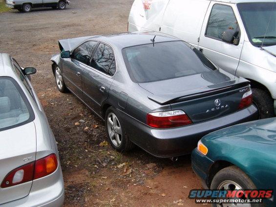 2003 Acura TL with front-end damage parked next to other vehicles