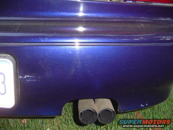 passenger side rear bumper, dent next to the license plate was there since i bought the car, not sure where the mark next to the muffler came from...
