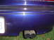 1996 Mazda MX-6 - passenger side rear bumper, dent next to the license plate was there since i bought the car, not sure where the mark next to the muffler ca…