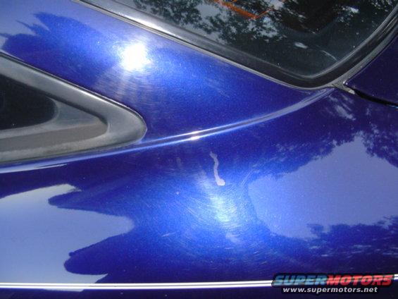 drivers side quarter panel... strange drip like mark... hasnt changed since purchase of car... 