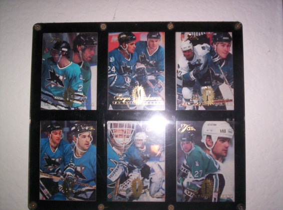 Collection of hockey cards players in teal and white uniforms