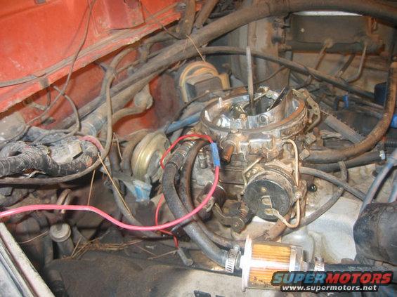 Engine bay with carburetor and fuel filter