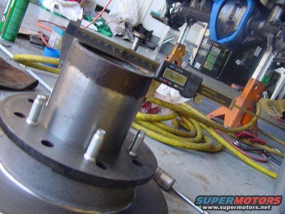 Hub and brake rotor being measured by digital caliper