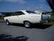 1966 Ford Fairlane - This white 1966 Ford Fairlane 500 is shown from the rear quarter angle, chrome wheels and a clean body style.