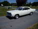 1966 Ford Fairlane - A white 1966 Ford Fairlane is parked on a suburban street on a sunny day.