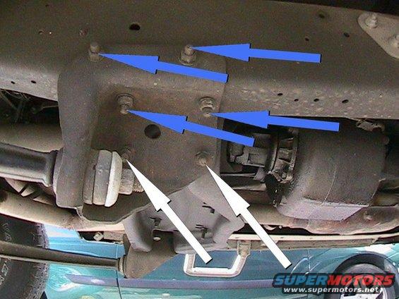 The white arrows show the bolts for the cross member that need to be removed.  The blue arrows show the bolts that may need to be removed to get the radius arm bracket out of the way in order to drop the cross member.