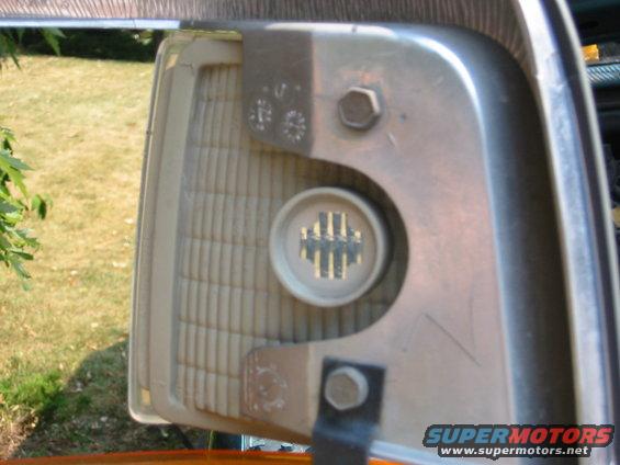 two bolts hold the side light, they come out nice and easy