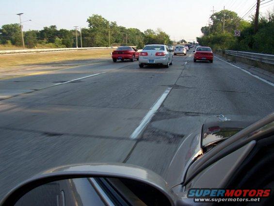 Traffic on a highway with several cars visible in different lanes