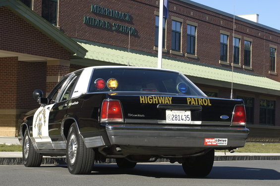 Rear view of a 1991 Ford Crown Victoria highway patrol car with California plates