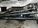 1979 Ford Bronco - Close-up view of a vehicle's undercarriage, focusing on the differential and steering components.