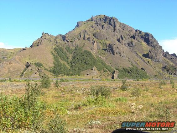 Mountain landscape with a road and a watermark