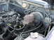 1983 Ford F-250 - Close-up view of the engine compartment, showing various mechanical components and wiring harnesses.