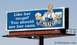 2005 BMW 3 Series - A billboard features the St. Pauli Girl mascot holding mugs of beer, with the text 'Like her mugs? You should see her cans.'