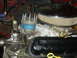 1986 Ford Mustang - The engine bay shows a distributor, air cleaner assembly, and part of the valve cover.