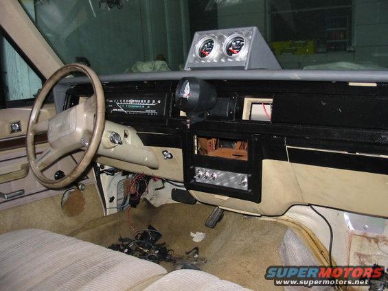 1985 Ford Crown Victoria LTD interior showing dashboard, steering wheel, and aftermarket gauges