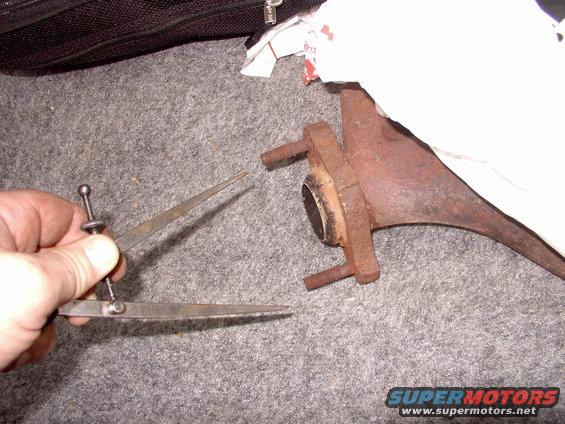 The stud centers on a 1990 Lincoln Town Car's header-like manifolds are 3 3/4" center to center.