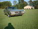 1971 Ford Torino - A silver 1970 Ford Torino is parked on a grassy lawn with a brick house in the background.