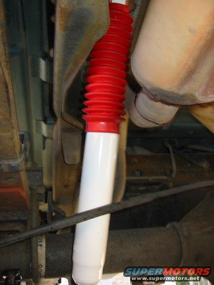 ranchos-008.jpg passenger's side.  just me or does the s-d exhaust run it pretty close to the shock boot and break lines?  Anyone have some solutions that won't bankrupt me?  