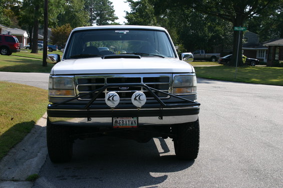White 1994 Ford Bronco front view with bull bar and KC lights