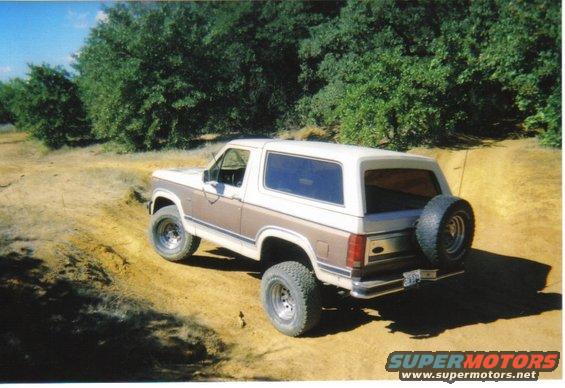 Ford Bronco driving on a dirt road