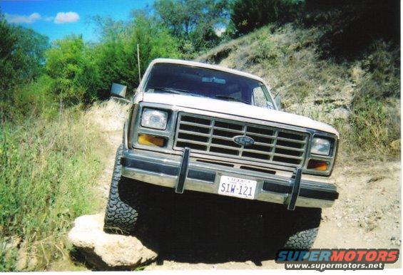 White 1980 Ford Bronco front view on a rocky trail