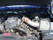 1995 Ford C-350 (Centurion Conversions) - Close-up view of the engine bay, highlighting the turbo diesel engine components and air intake system.