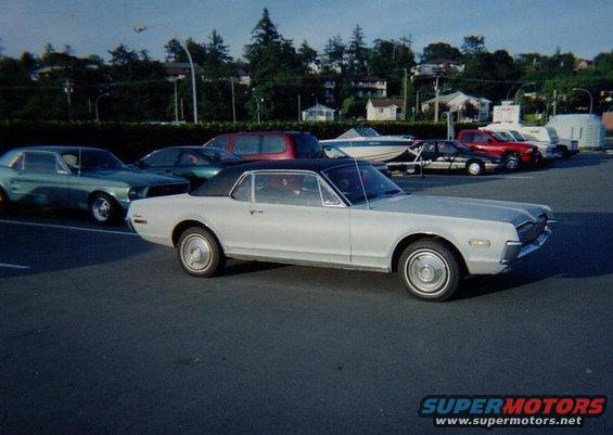 Silver 1968 Mercury Cougar, 3/4 front view, parked in lot