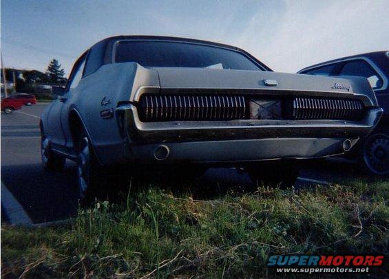 1968 Mercury Cougar, rear view, light blue, parked on grass
