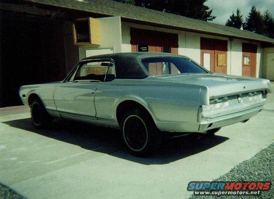 Silver 1968 Mercury Cougar coupe, rear view, black vinyl top