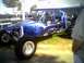 2005 BMW 3 Series - A custom blue dune buggy with flame graphics is parked outdoors.