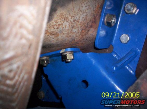 Blue suspension part with bolts and rusty metal, timestamp 09/21/2005