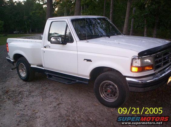 White Ford F-150 pickup truck parked outdoors
