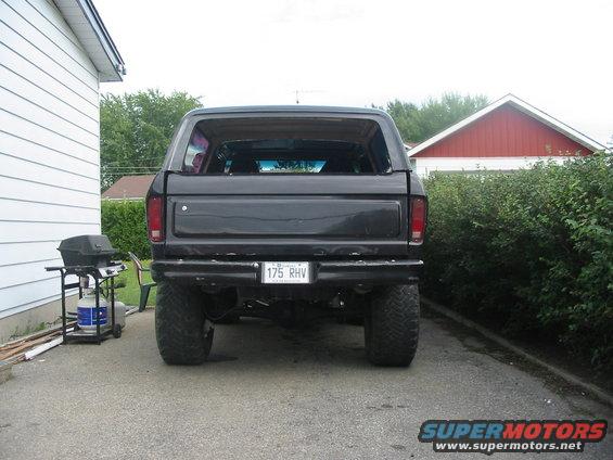 Black Ford Bronco parked in driveway, rear view. License plate reads 175 RHV