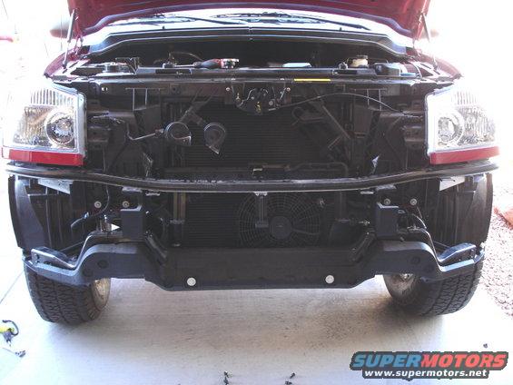Front of a 2005 Nissan Titan with the bumper removed, showing the radiator and fan