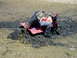1984 Honda ATC 250 R - ATV rider gets stuck deep in the mud, requiring assistance to get out.