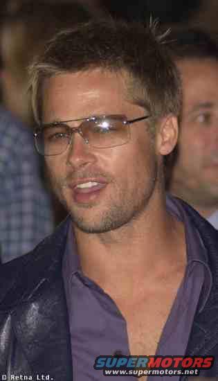 Man wearing glasses and a purple shirt