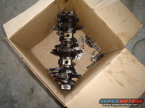 Engine camshaft and lifters in a cardboard box