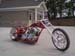 Chopper motorcycle with a long front fork and custom red and chrome bodywork