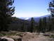 1989 Ford Bronco - A scenic view of a mountainous region with a body of water visible in the distance.